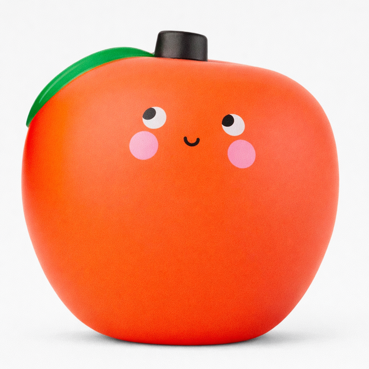 Cute orange apple-shaped figure with a smiling face, blush cheeks, and wide eyes. It has a green leaf and black stem on top, creating a playful tone.