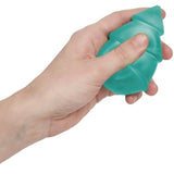 Side view of a hand squeezing a green silicone Speks tree fidget toy.