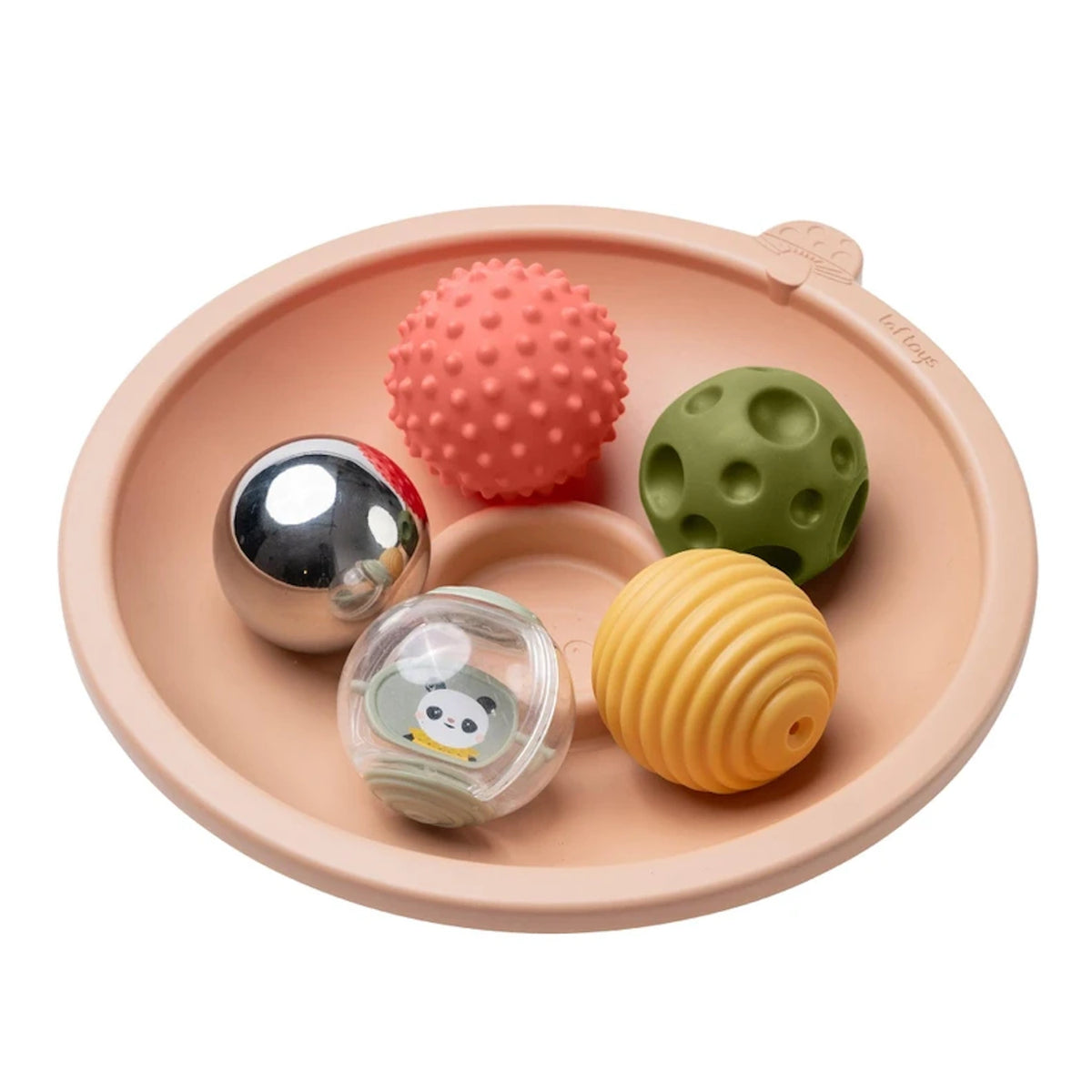 Peach play tray filled with five textured sensory balls, including a spiky, dimpled, and shiny metallic ball.