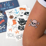 Child wearing a skull and crossbones temporary tattoo with pirate sheet pack in background.