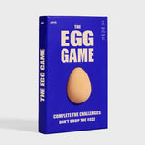 Front packaging of The Egg Game in a blue box featuring a brown egg shape in the center.