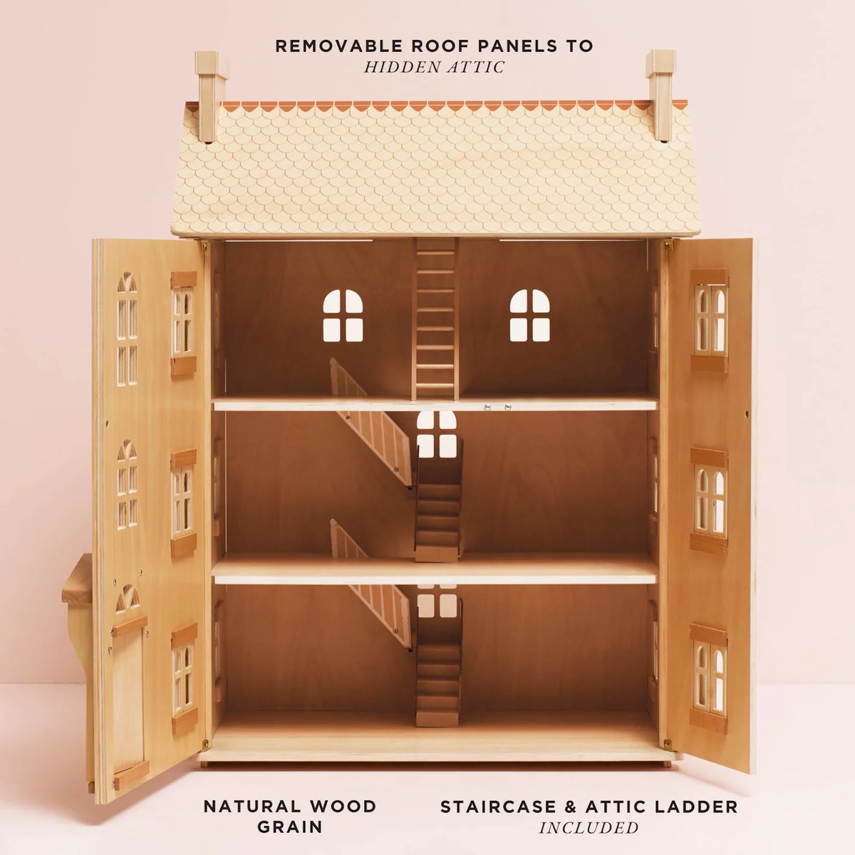Wooden dollhouse with three levels, featuring a natural wood finish, removable roof for attic access, and a staircase with an attic ladder.