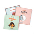 Light blue fabric cover of "my say Hello book" next to its open pink gift box.