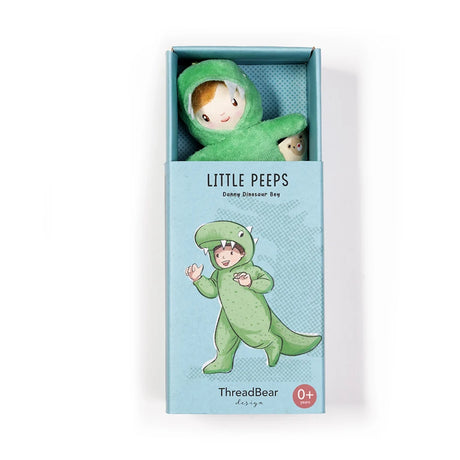 "Little Peeps Danny Dinosaur Boy" plush toy peeking out from its blue illustrated box.