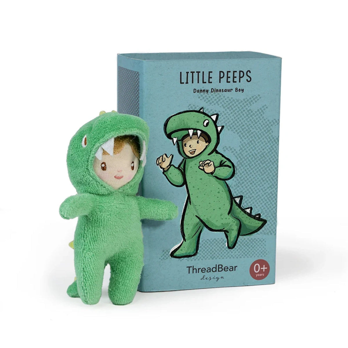 Small "Little Peeps Danny Dinosaur Boy" plush toy standing beside its blue illustrated box.