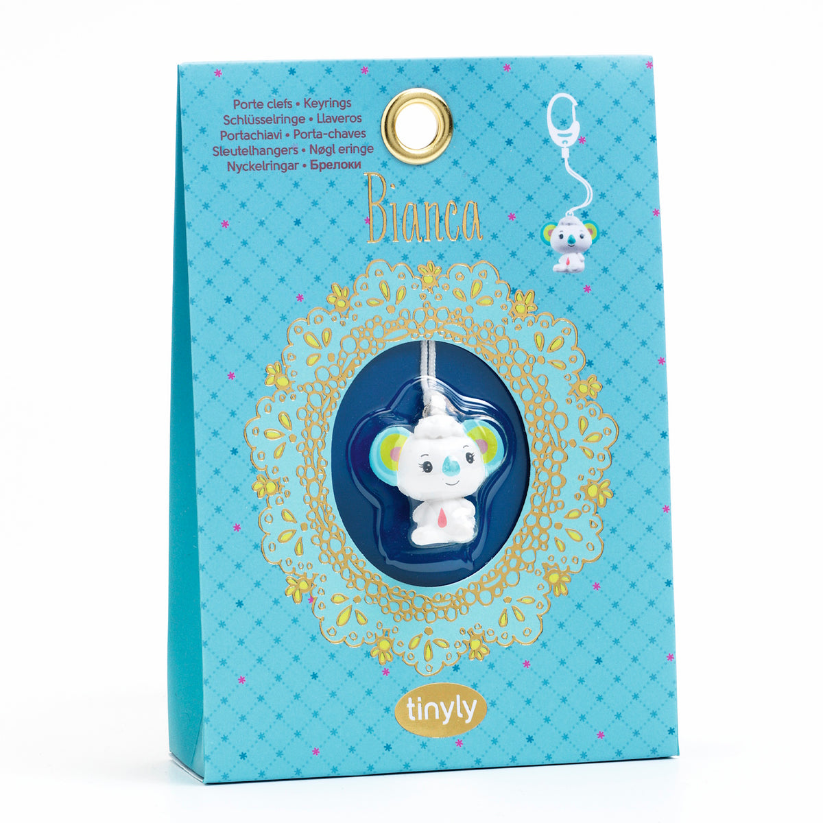 A cute, stylized koala charm with colorful ears, a smiling face, and a small red drop on its chest, hanging from a white string.