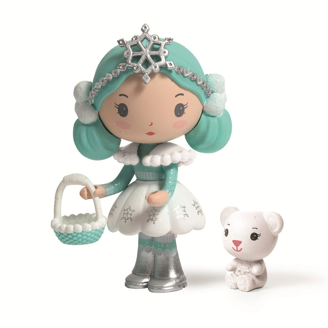 A cute, mint-haired doll in a snowflake-themed dress holds a basket, next to a small white bear figurine in a white background.