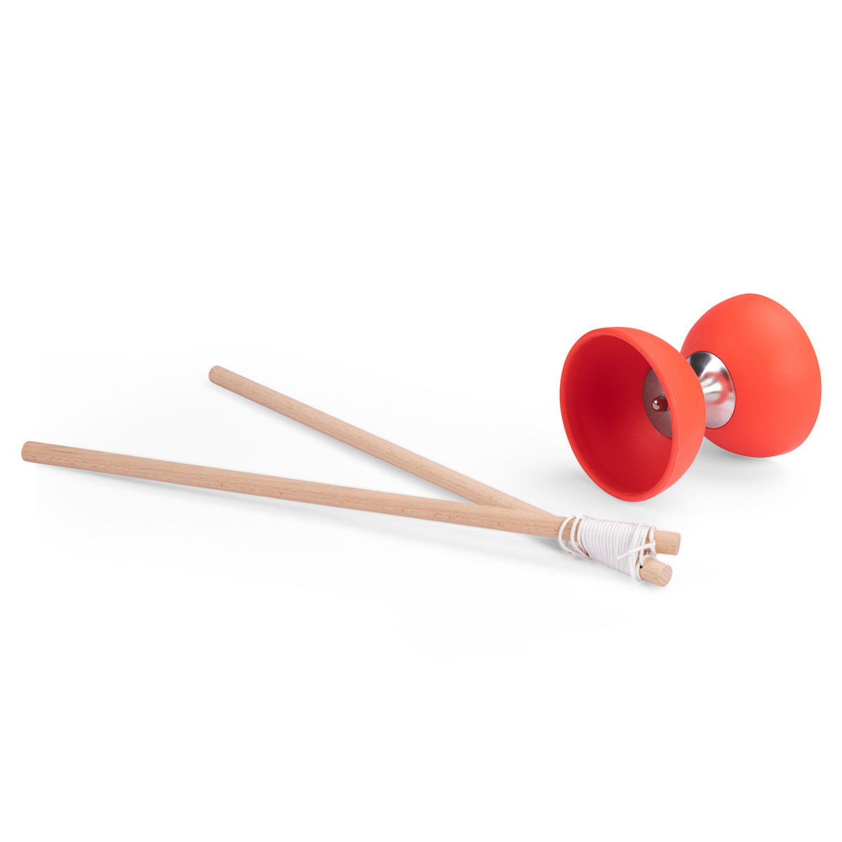 A red diabolo with wooden sticks wrapped in white string. The diabolo's metal center is visible. The setup suggests a playful, juggling activity.