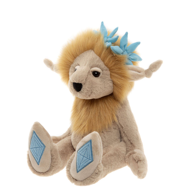 Plush cream creature with a fluffy golden mane, light blue flowers on top, and diamond foot pads.