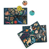 Tout Autour du Monde animal seek and find card game featuring colorful illustrations of wildlife on dark blue cards.