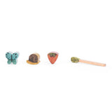 Moulin Roty wooden shape sorter pieces and xylophone mallet from the turtle activity toy.