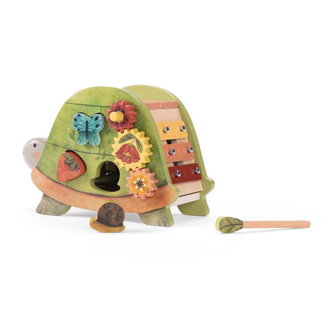 Moulin Roty wooden turtle activity toy featuring a xylophone and flower gears.