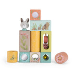 Trois Petits Lapins wooden stacking activity blocks with rabbit and nature illustrations.