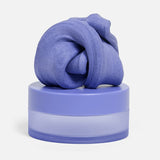 Swirled periwinkle-blue focus putty sitting on top of its matching circular container.