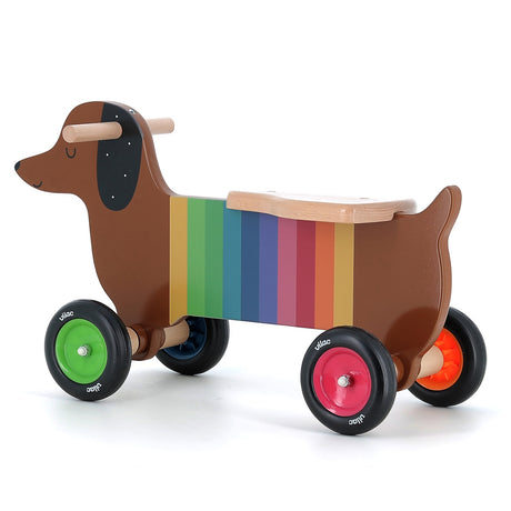 Vilac rainbow dachshund wooden ride-on toy for toddlers with colorful wheels and easy-grip handles on a white background.