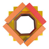 Top-down view of Vilac Batibloc wooden building planks stacked in a colorful geometric pattern.