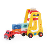 Vilac wooden container crane toy straddling a red toy semi truck loaded with colorful cargo blocks.