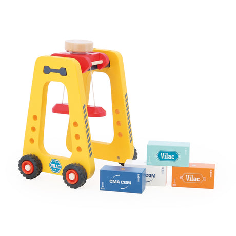 Vilac wooden container crane toy next to scattered colorful CMA CGM toy shipping blocks on white background.