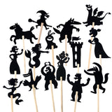 Fairytale shadow puppets on wooden sticks featuring a dragon, witch, princess, fairy, and castle.