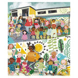 Diverse group of children and adults playing outside a colorful school building with vibrant murals and patterns.