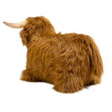 Fluffy brown plush toy resembling a Highland cow, with long fur and curved horns, set against a white background, conveying a cozy and whimsical feel.