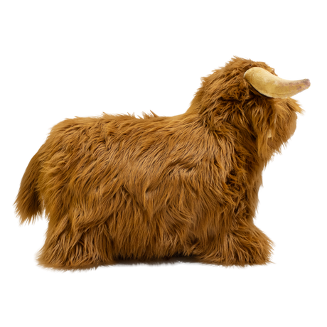 Fluffy brown plush toy resembling a Highland cow, with long fur and curved horns, set against a white background, conveying a cozy and whimsical feel.