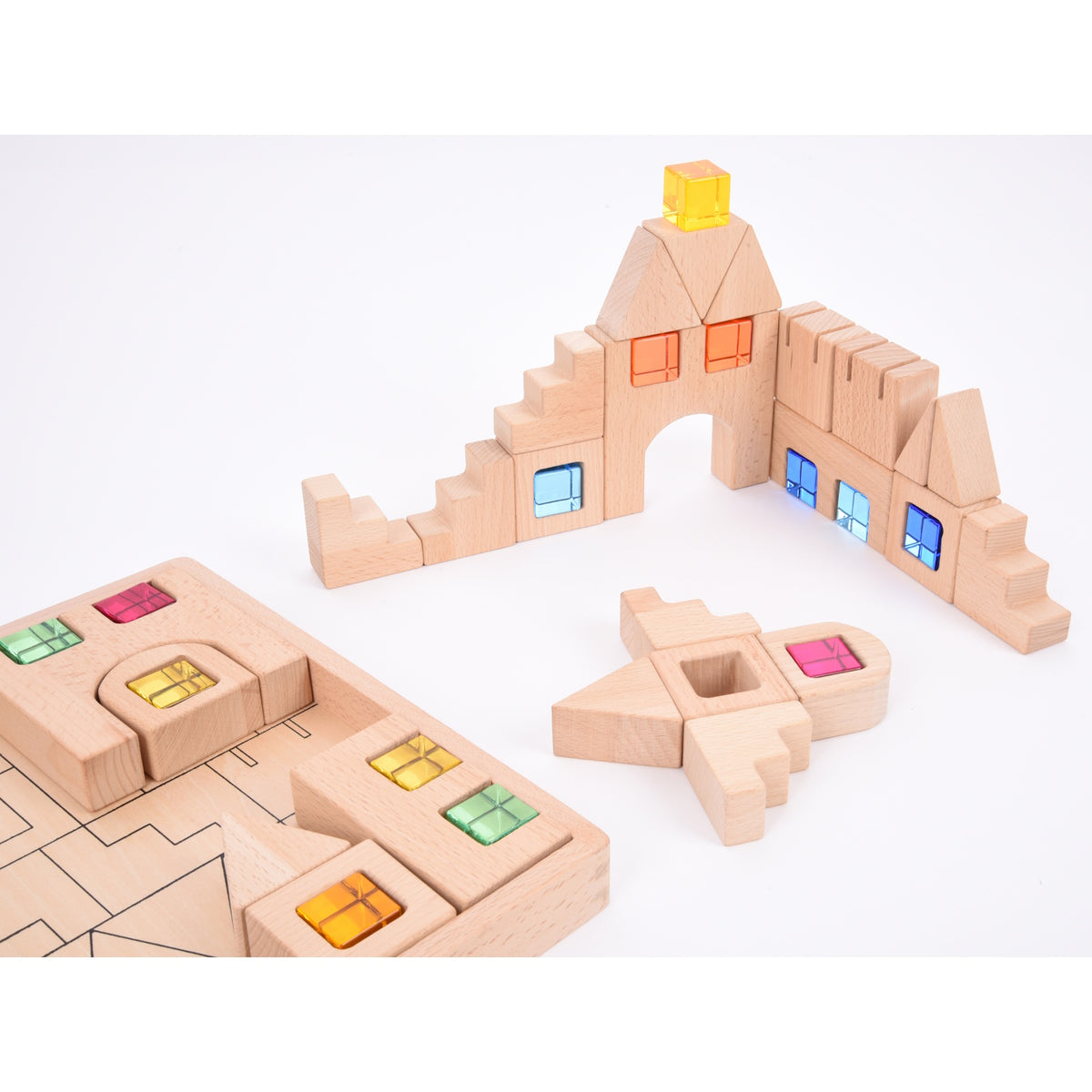 A set of wooden construction blocks with embedded colorful gems, designed to enhance imaginative play, light exploration, and fine motor skills.