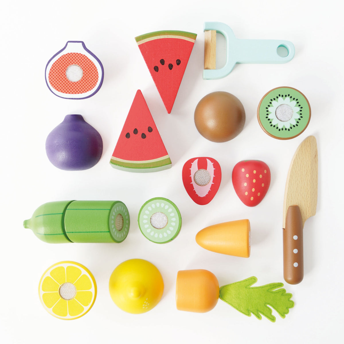 Top-down view of wooden sliceable toy fruits, vegetables, peeler, and knife on a white background.