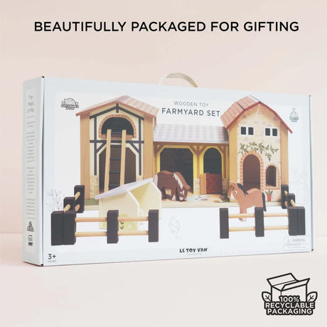 Le Toy Van wooden toy farmyard set packaged in a gift box with a carrying handle.