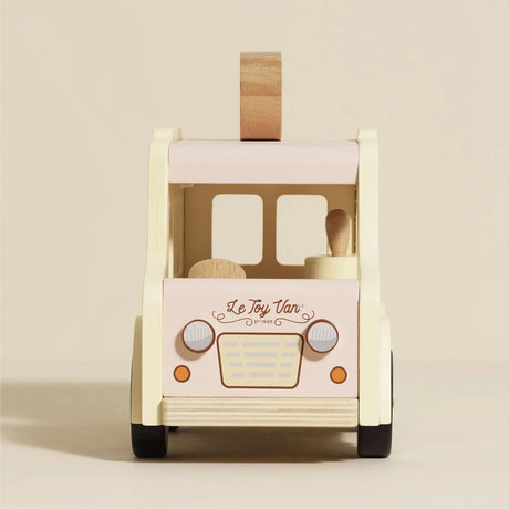 Front view of Le Toy Van wooden ice cream toy with headlights and grille.