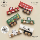 Six-piece wooden toy truck set with three cab trucks and three removable matching trailers.